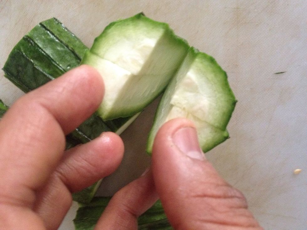 Cut the gourd in 4 pieces and then slit as shown to stuff the masala