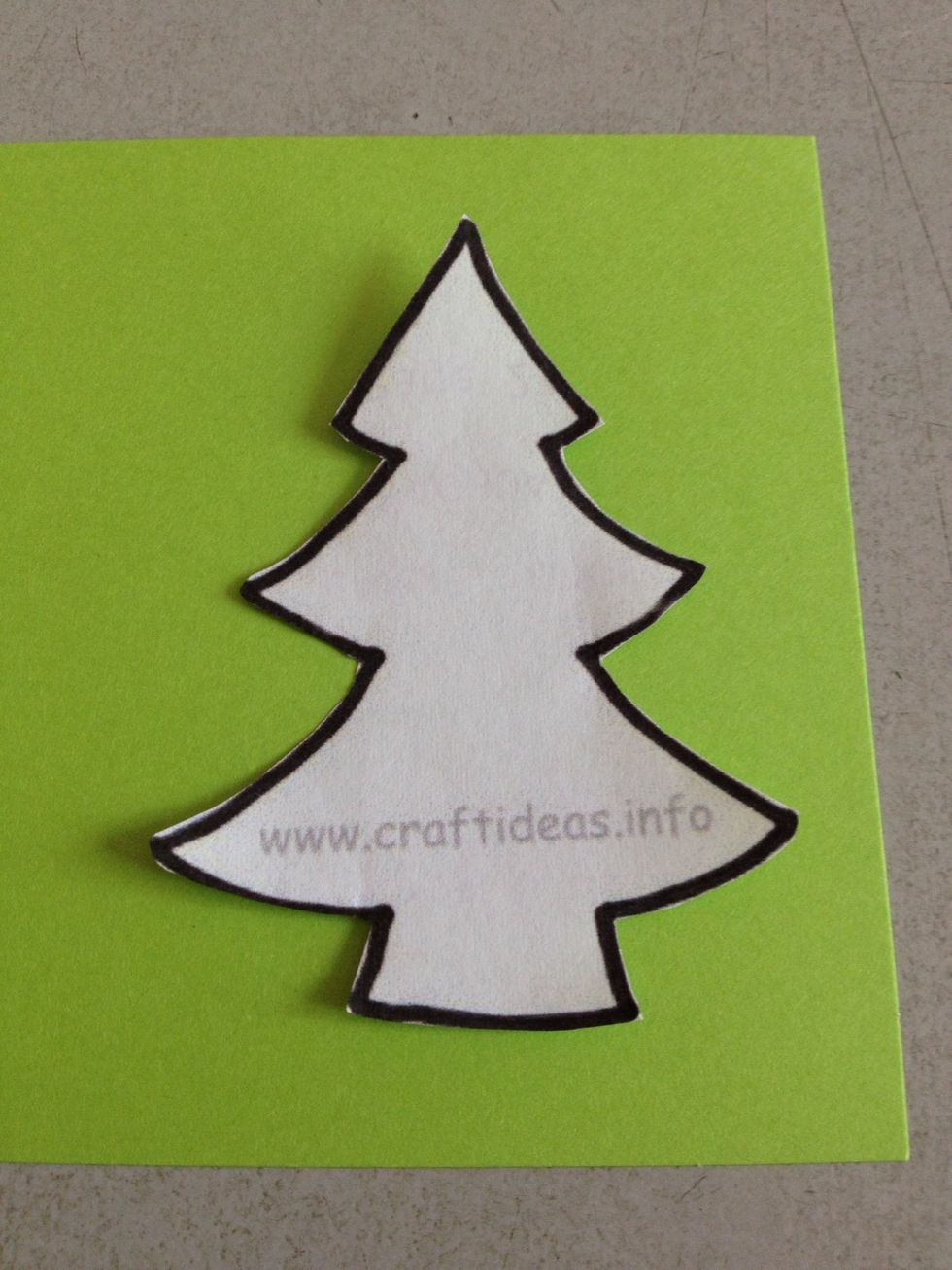 Cut the green paper using the template. Or if you wish, you could have a white Christmas or red Christmas as well...