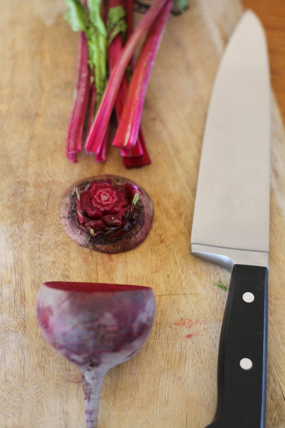 Cut the greens off the top of the beet, leaving 1/4" of the stems attached. Cut the bottom of the beet off the disk where stems are attached (make delicious things w/ both the discarded beet & greens)