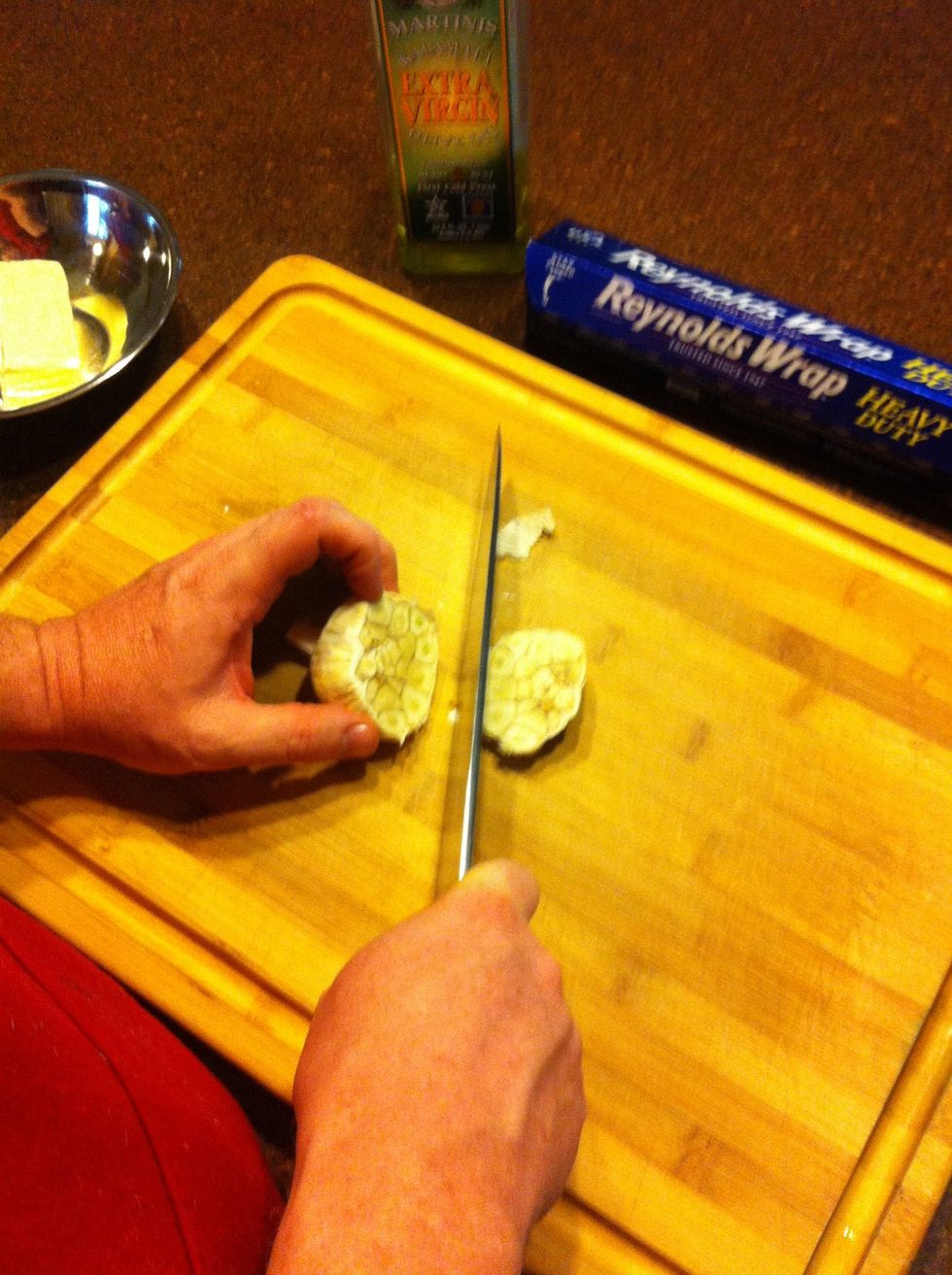 Cut the heel off the head of garlic, leaving all the cloves together in one bunch.