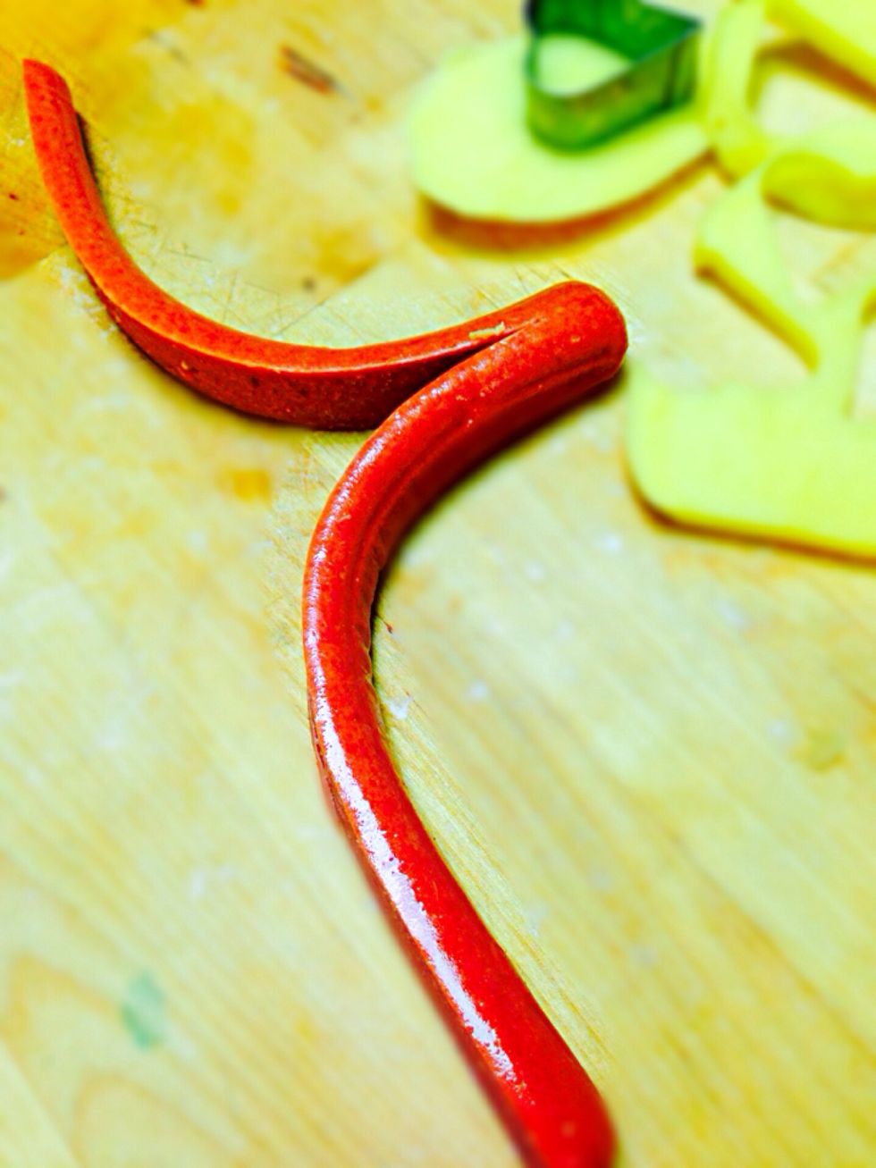 Cut the hotdog lengthwise but not all the way through