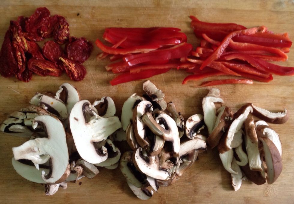 Cut the ingredients. I have cut the mushrooms in slides but you can cut them in cubes or little pieces. The red pepper is better in slides.  Parallely put the tomatoes in water so they get hydrated.