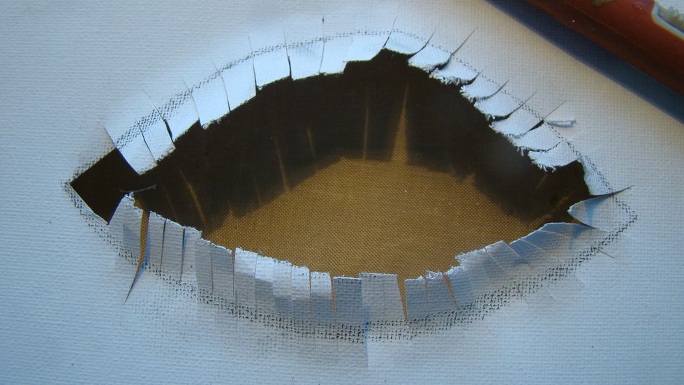Cut the inside eye out and then snip the eyelashes back to the outside eye lines.