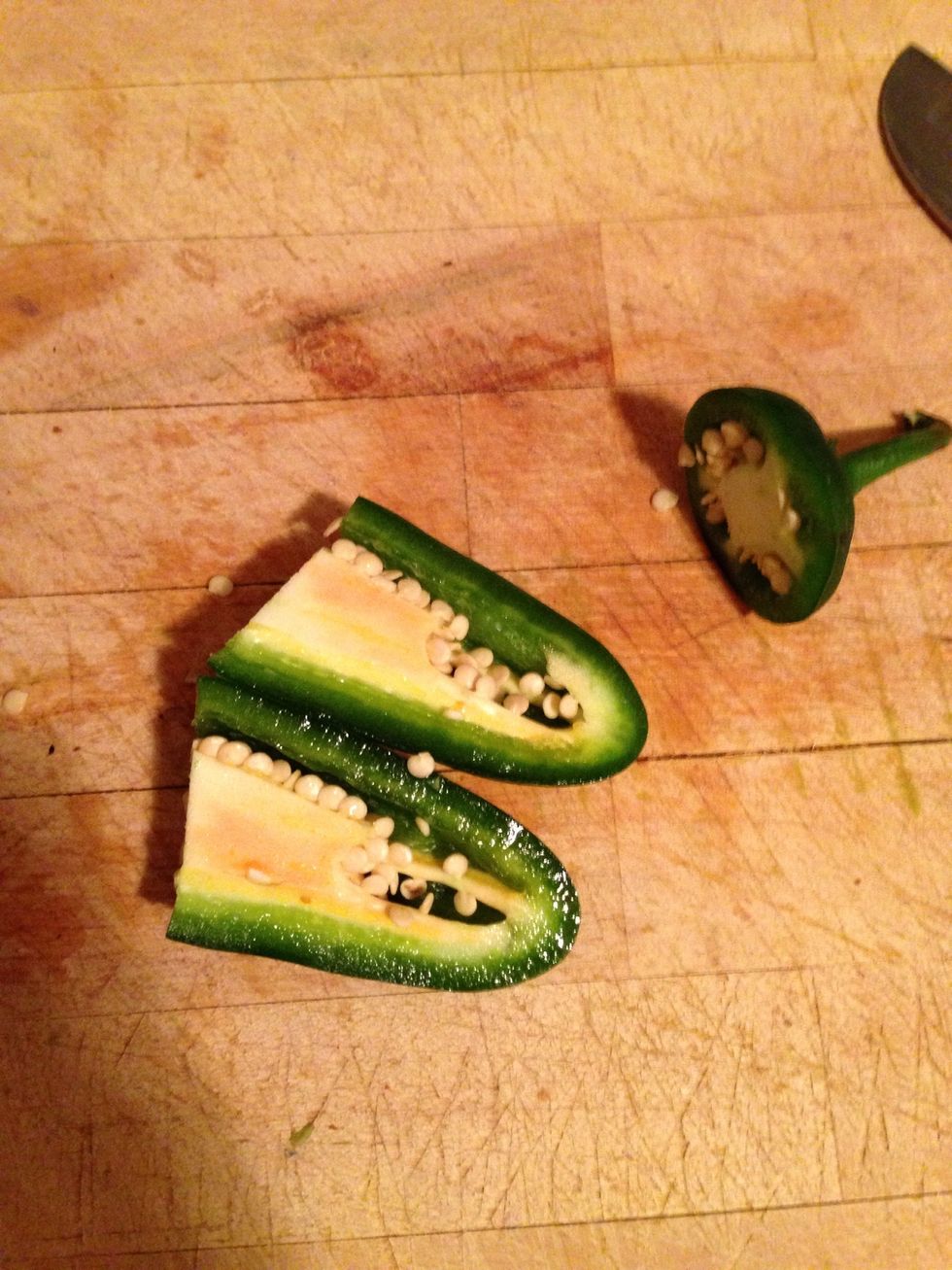 Cut the jalape\u00f1o in half.