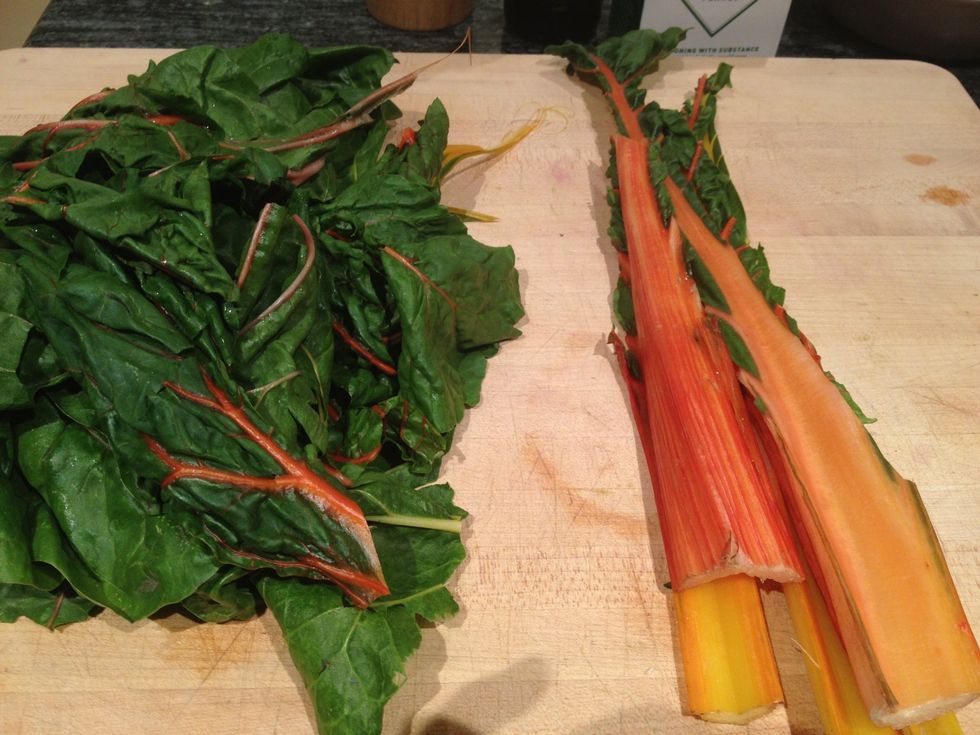 Cut the leaves away from the stems of the rainbow chard.