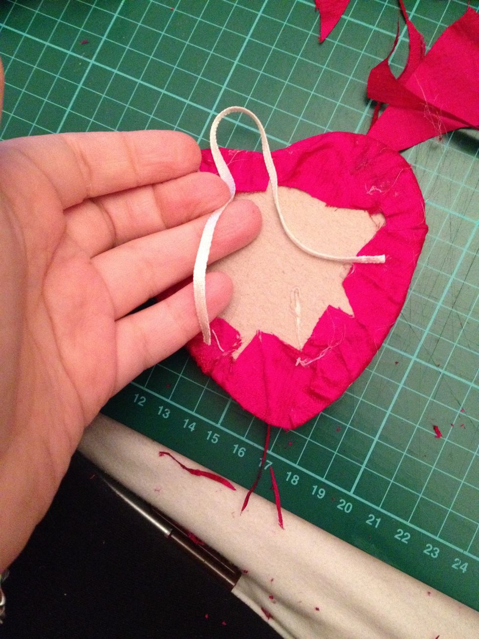 Cut the length ribbon you want to use to hang it
