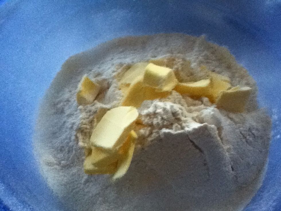 Cut the margarine into small pieces and add to flour. Rub in the margarine using the fingertips.