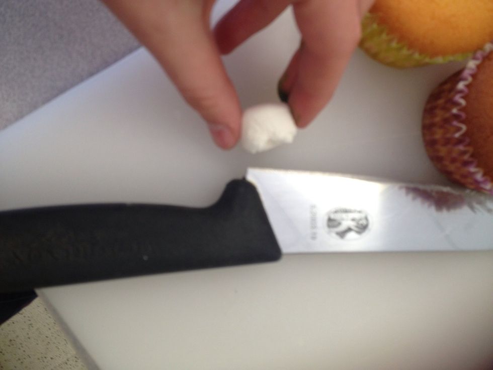Cut the marshmallow in half