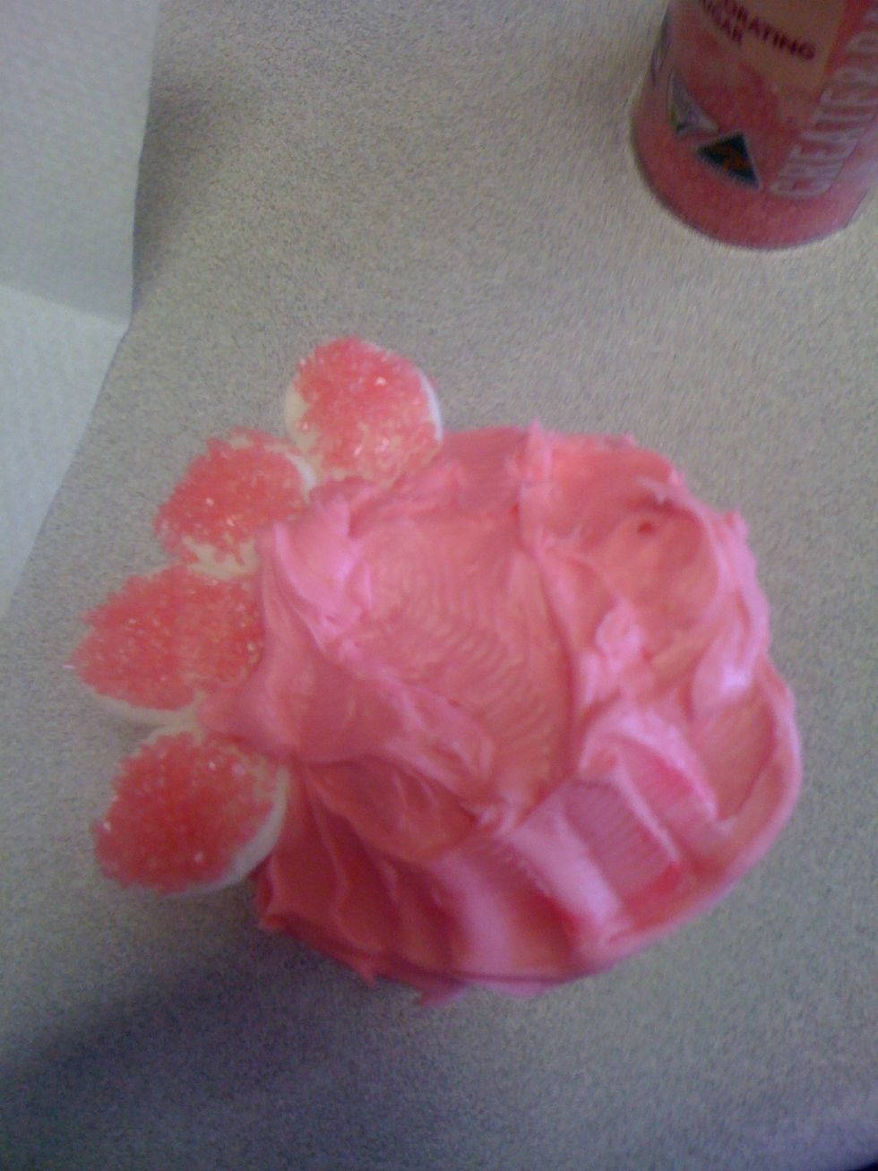 cut the marshmallows in half and dip them in sugar, sticking them side by side in the icing
