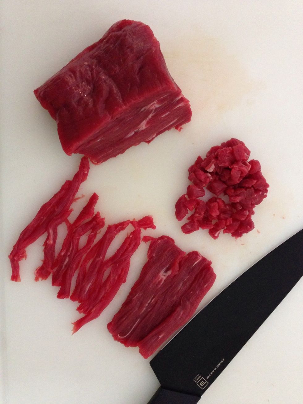 Cut the meat into cubes. Here I am using filet meat; very tender. So they don't have to be very small. Half way have a look at the onions.    Stir let them  continue to cook . Cut the rest of the meat