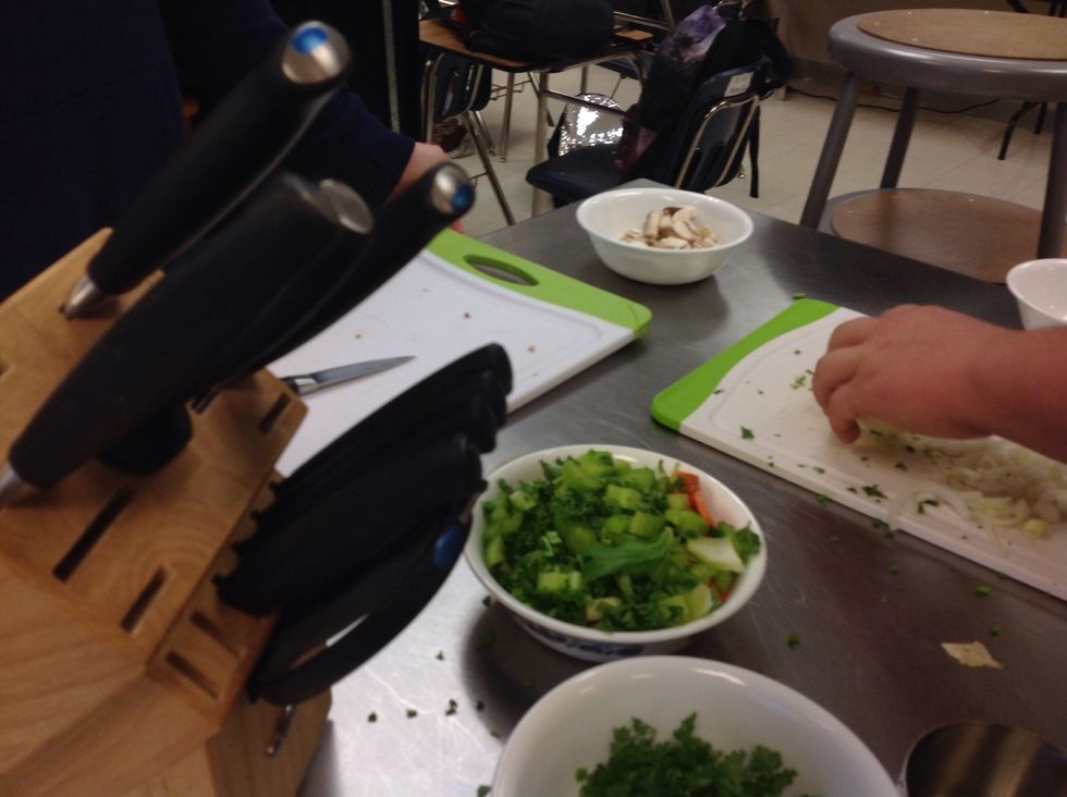 Cut the mirepoix ingredients.