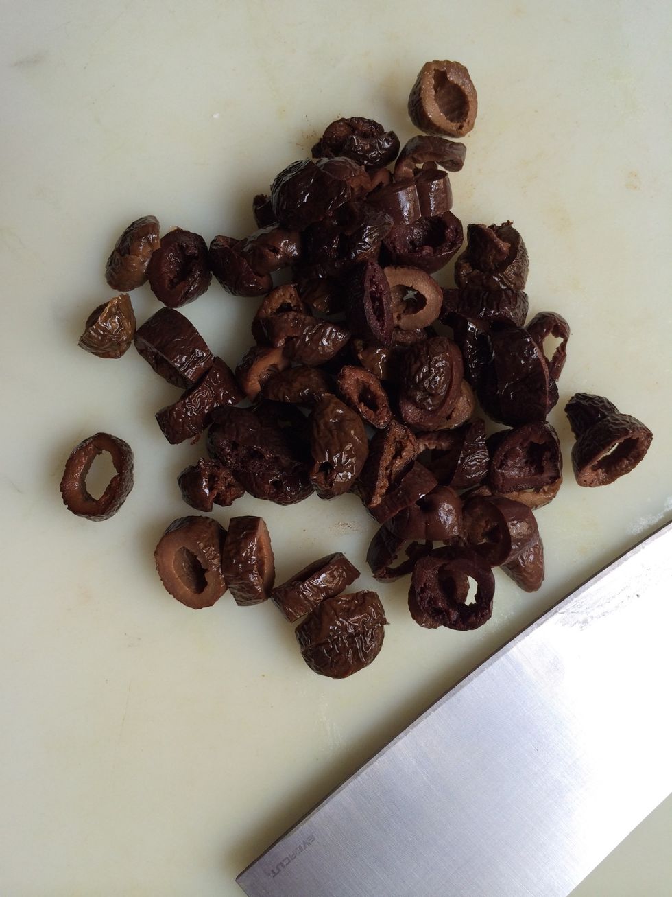 Cut the olives.. Each in 2 or 3 peices