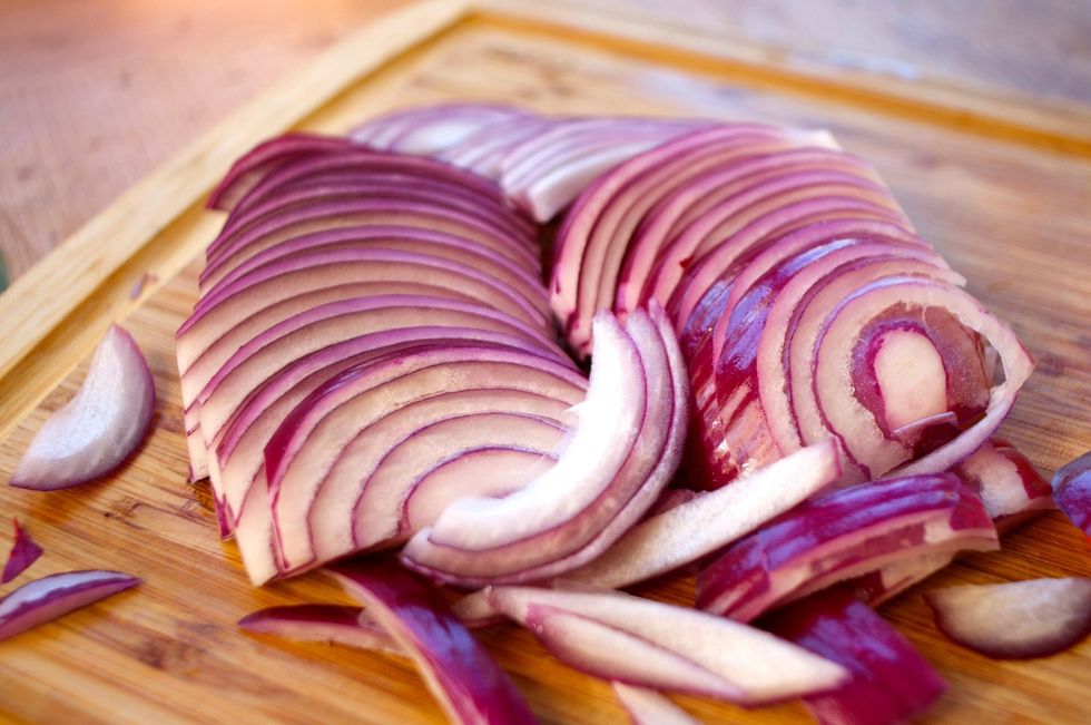 Cut the onion in half then slice about 1/4" thick slices. Did you know that onions help increase our bone density and help fight heart disease?