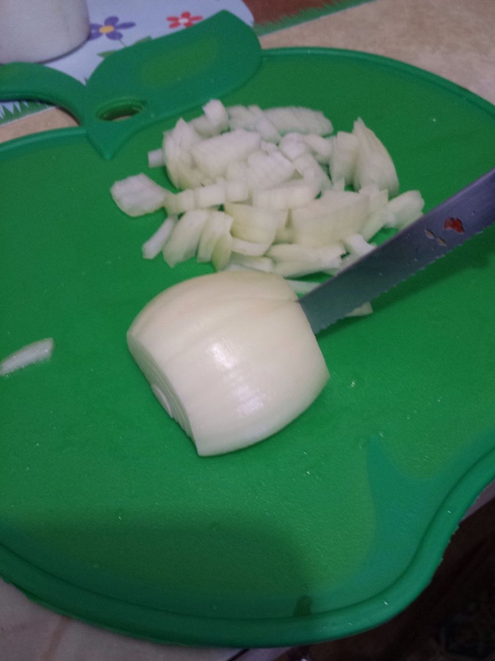 Cut the onion in strips but not cutting it all the way through. Just leaving it so the onion is still intact.