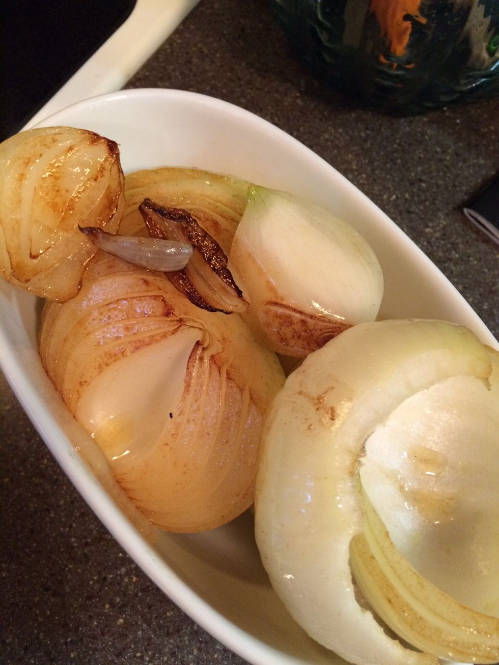 Cut the onions in half and trim the ends. Peel off the outer layers. I used sweet vidalia onions. Heat oil on med. high and brown onions all over, remove and place aside for later.