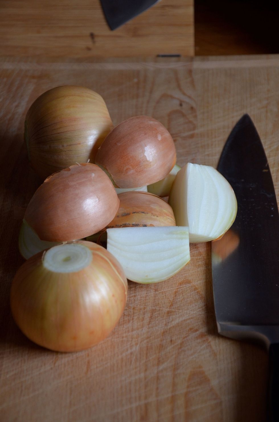 Cut the onions into quarters and leave some of the dry brown skin. They are good for flavor and color of the gravy.