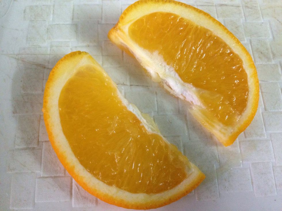 Cut the orange slice into 2.