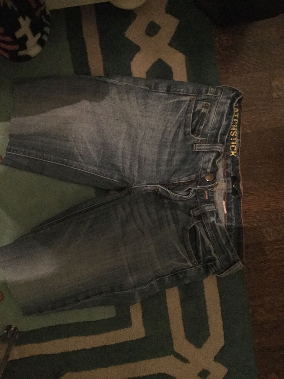 Cut the pant leg just above the knee, it does not have to be even