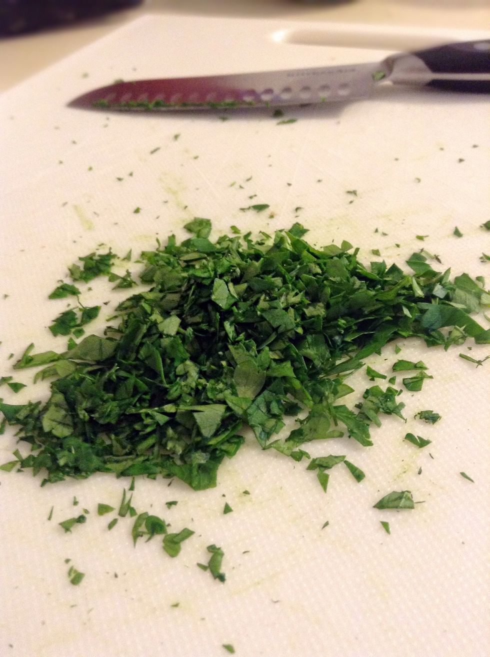 Cut the parsley as fine as you can get it. Place 3 tablespoons of the parsley in a small bowl and place one tablespoon of parsley in another bowl and set aside for later.
