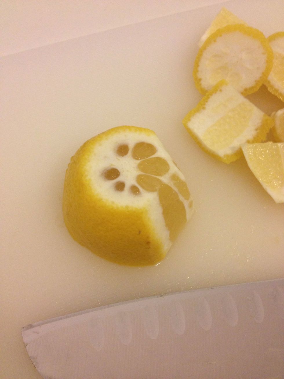 Cut the peel off the lemon and chop into chunks.