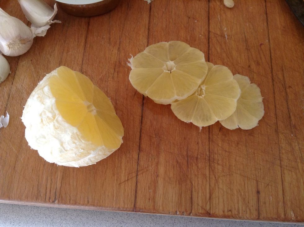 Cut the peeled lemon into slices