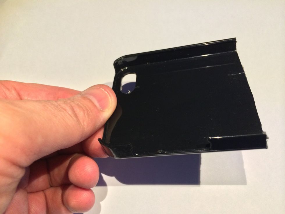 Cut the phone case in half and trim so the phone can be removed easily