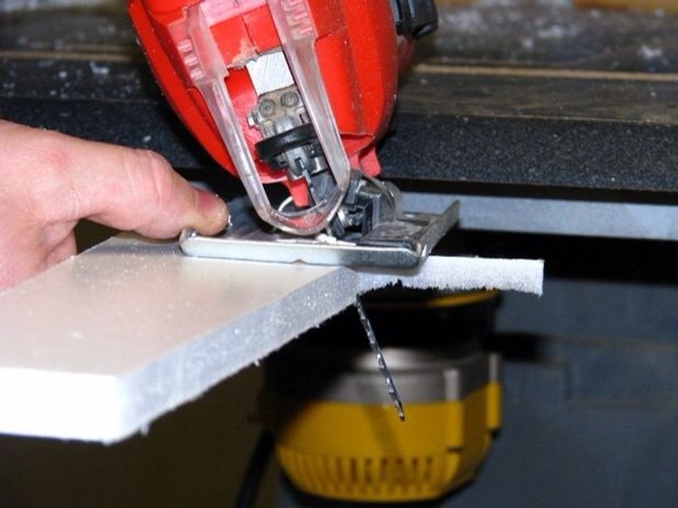 Cut the pieces out using the jigsaw. You can use an Exacto knife but the jigsaw is faster and easier to use.