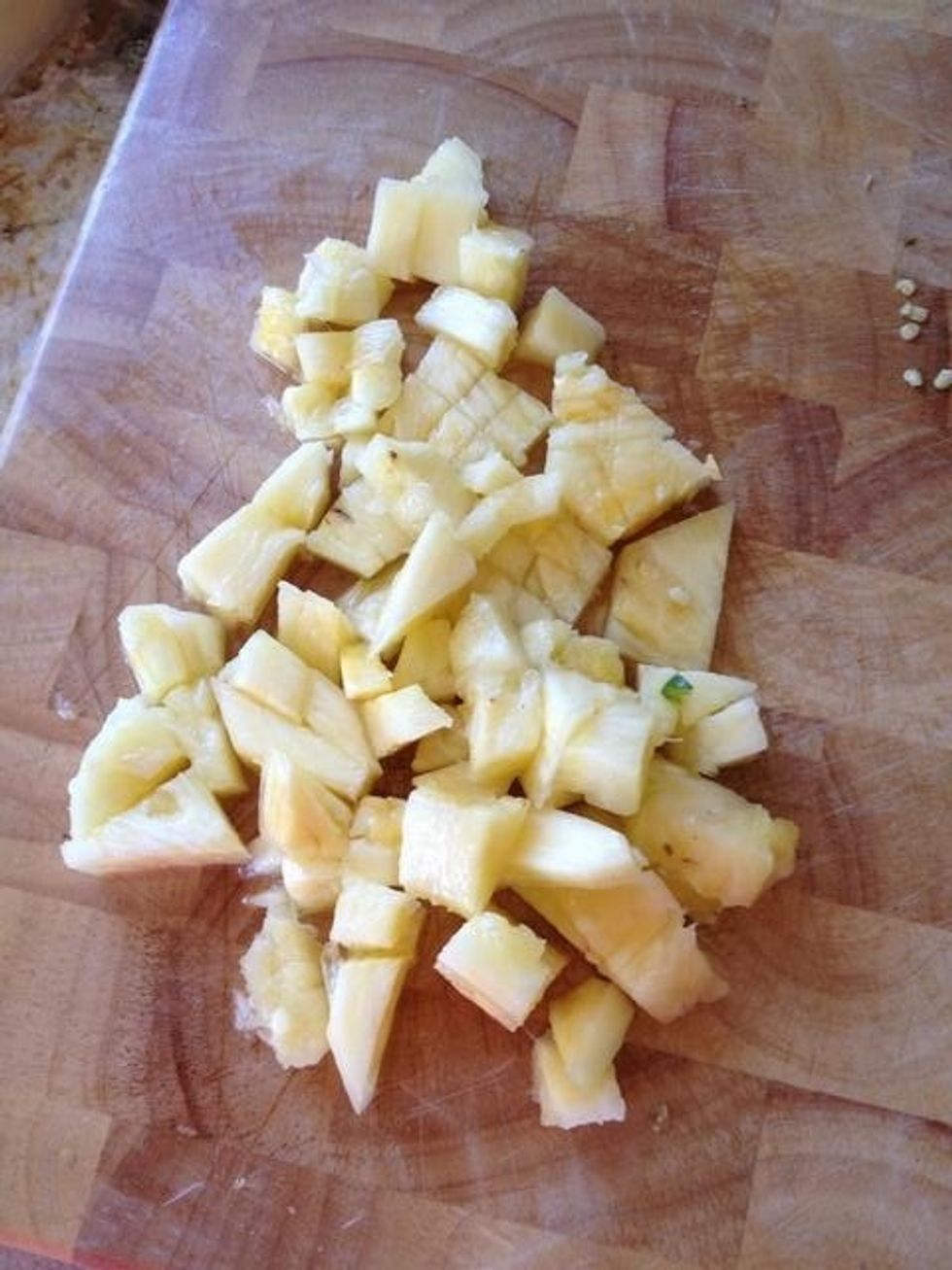 Cut the pineapple into small pieces.