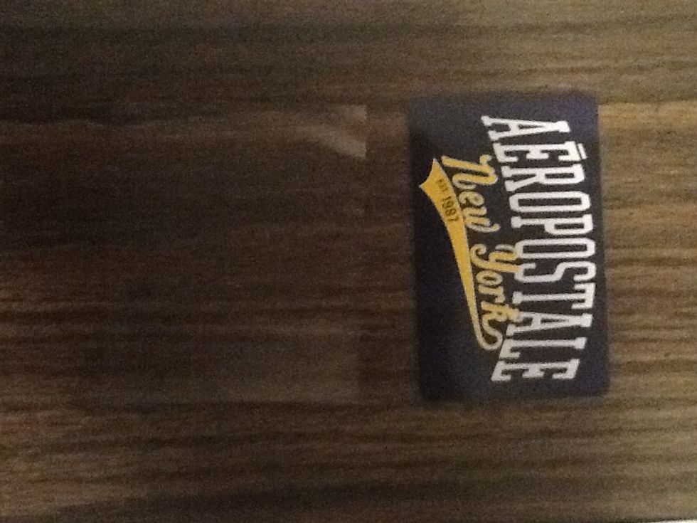 Cut the plastic sheet a little bigger than a card. In order for it to slip in.