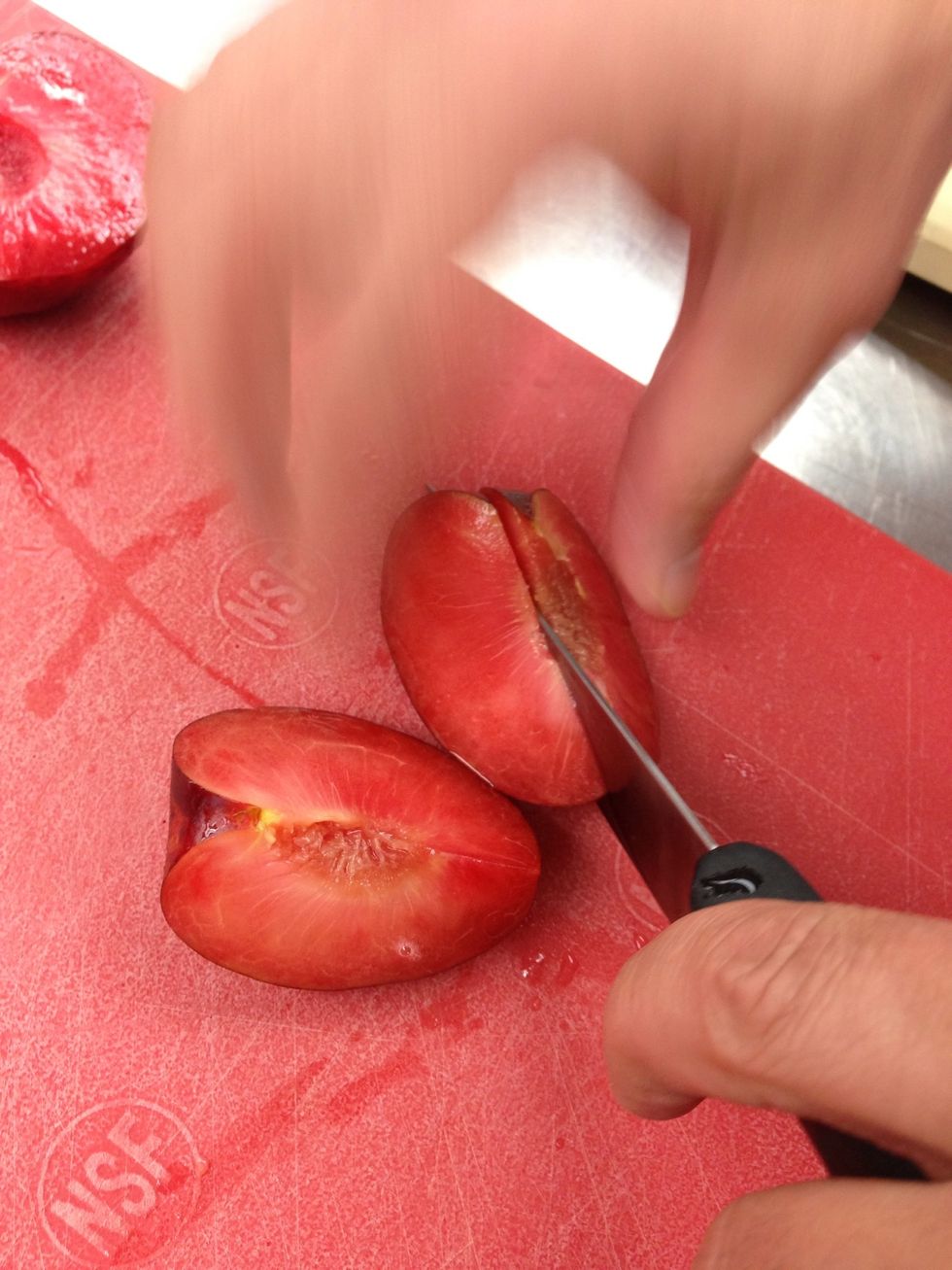 Cut the plums into wedges.