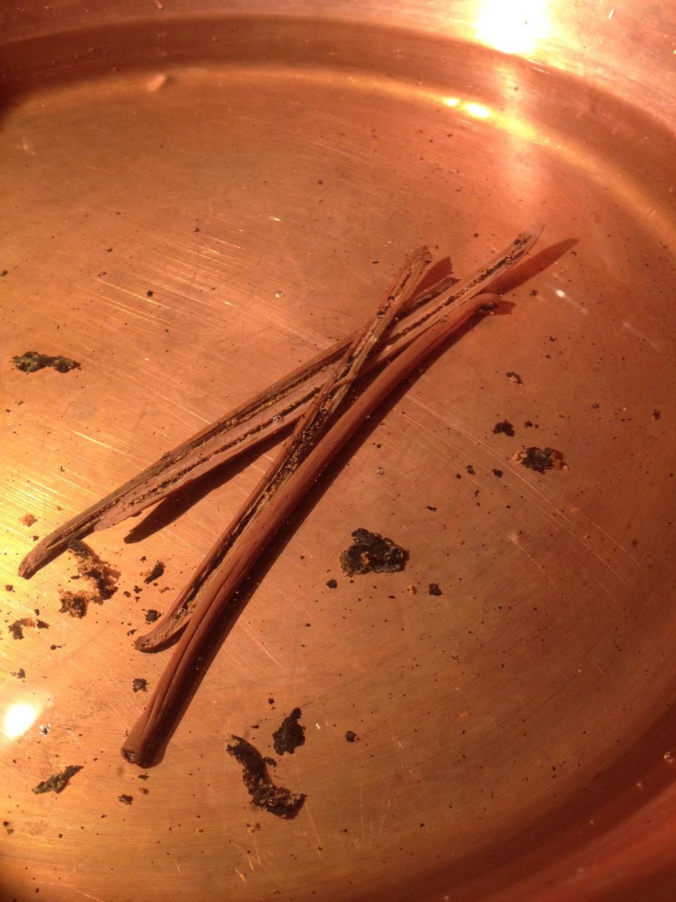 Cut the pods in the lengthwise and scrape out the seeds with a knife. Put everything in a preserving pan (or large pan), then add water.