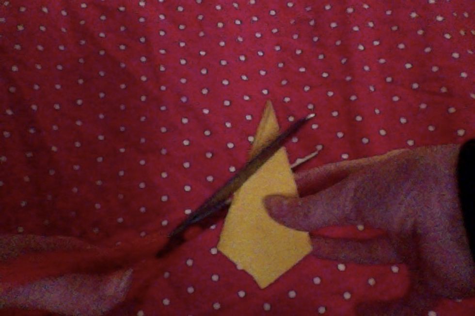 Cut the point diagonally. This will be your star.
