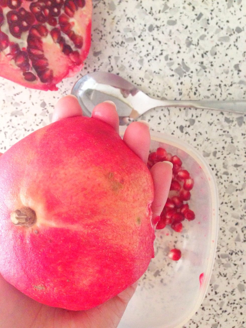 Cut the pomegranate in half. In the picture you see how to get the seeds. Use a spoon and tap (is this the right word??) on top. The seeds fall out :)