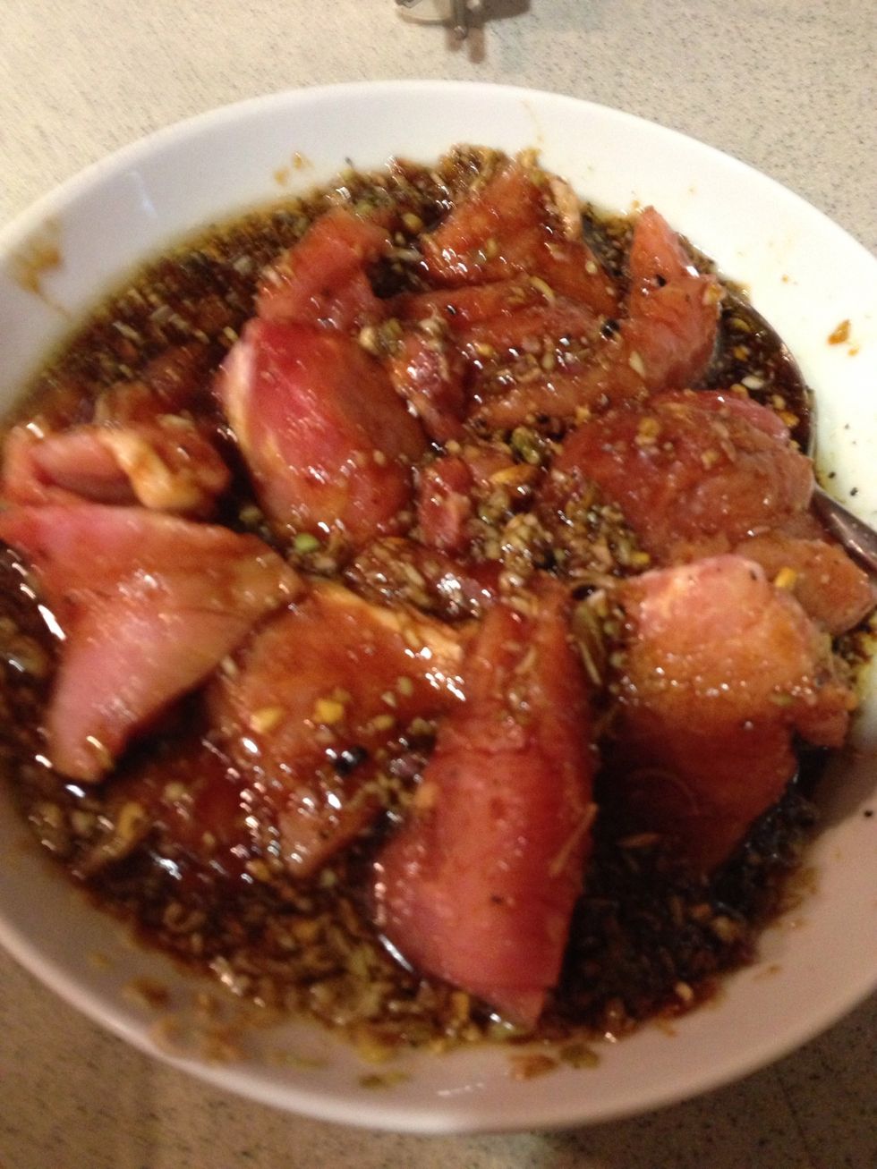 Cut the pork 1/4 inch. Remember not to use lean pork since it will dry out when you grill it. Add pork and mix it well.