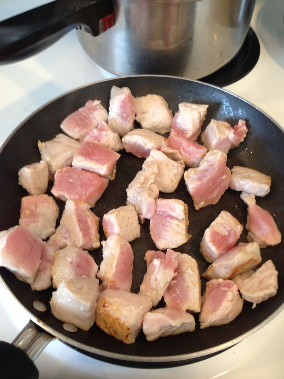 Cut the pork into cubes 1x1in. Add some olive oil in a medium sized pan. Fry pork til brown. (Mine aren't fully brown) Dump grease when cooked.