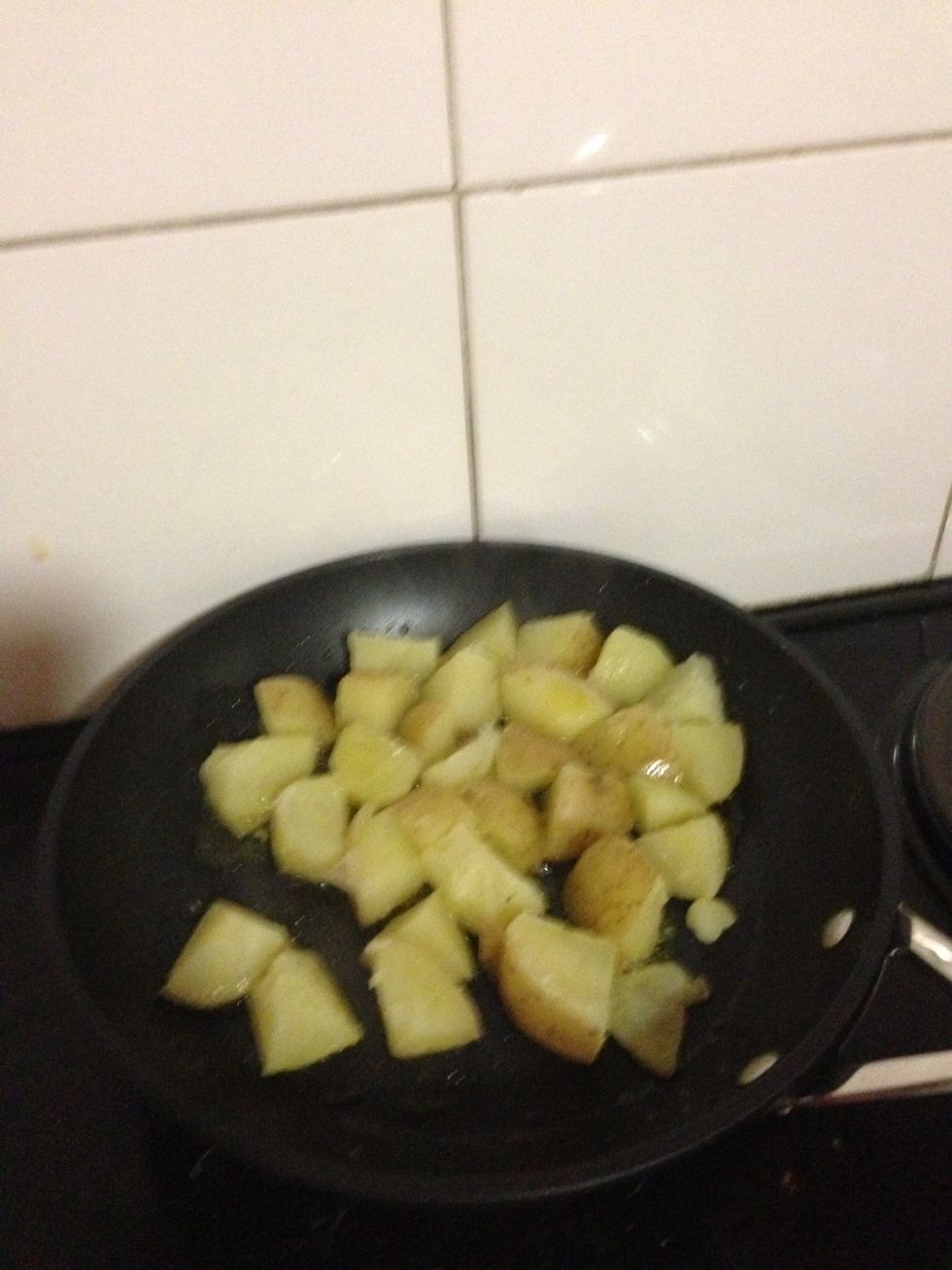 Cut the potatoes into smaller chunks and add to the hot pan