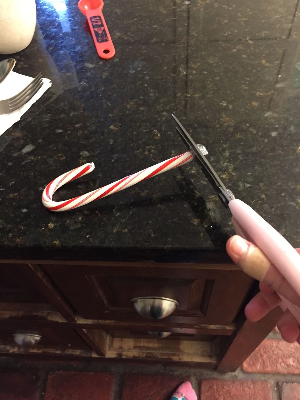 Cut the rapper on the candy cane all the way off