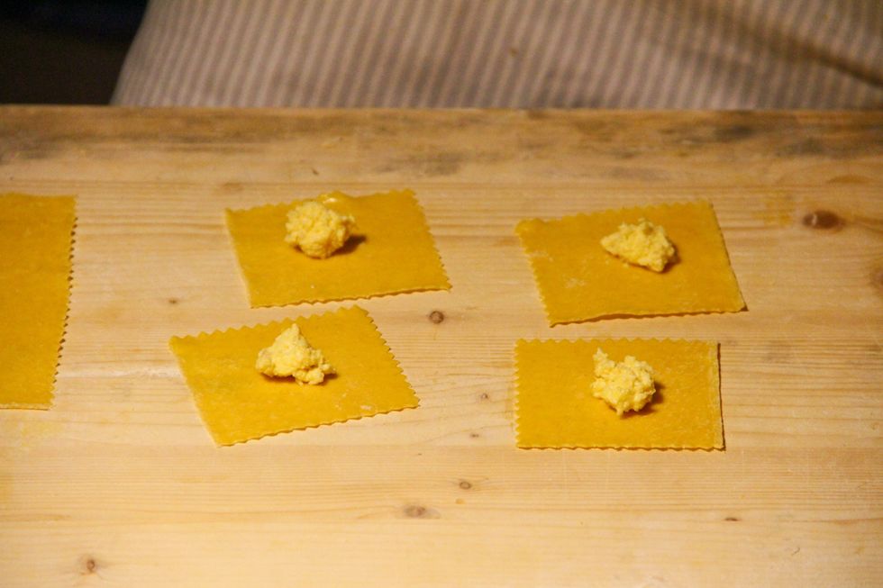 Cut the ravioli to shape bhush the edge with egg whiten fold the edge to close in shape