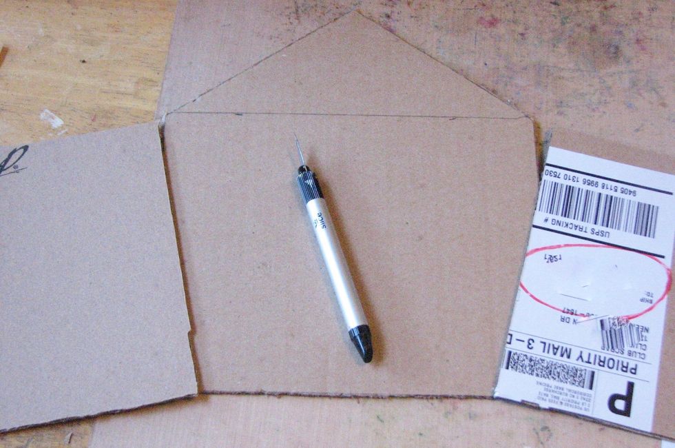 Cut the rectangle out. You can now cut the rectangle in two to create two doors for your album or leave it whole for a single album cover. I am using two doors to create a gate fold album.