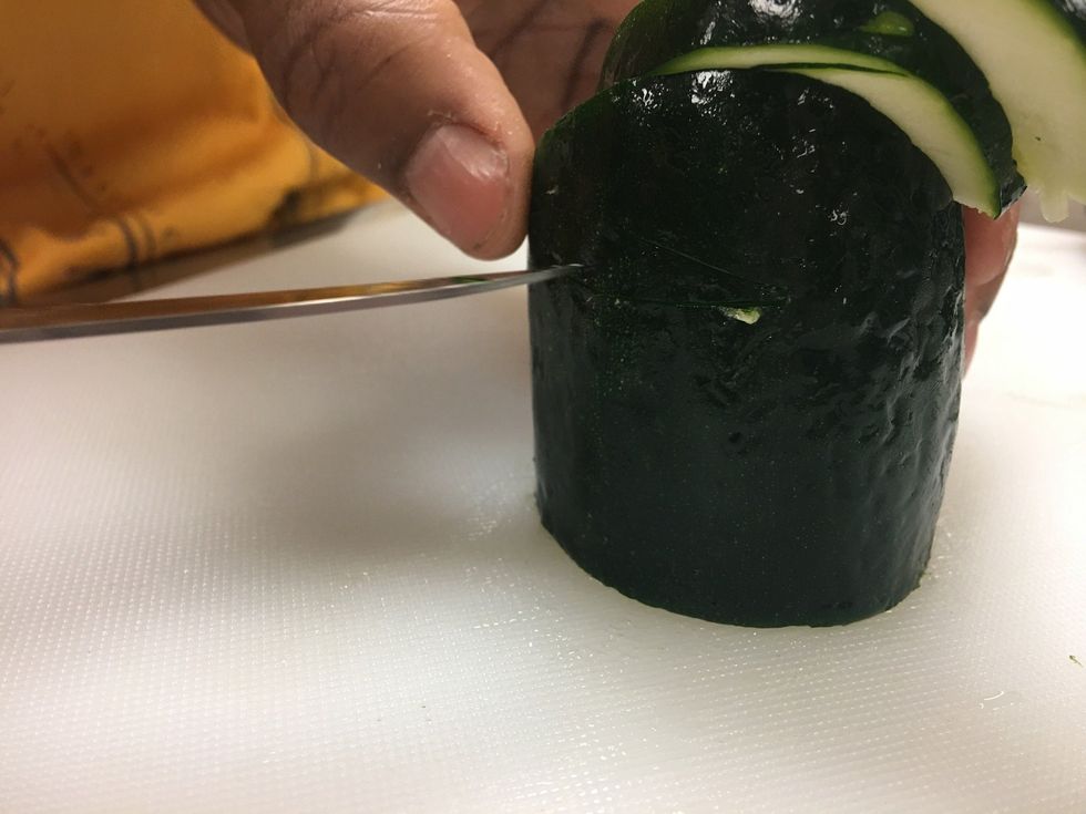 Cut the same way you did on the top, slant your knife and curve the cut on both sides.