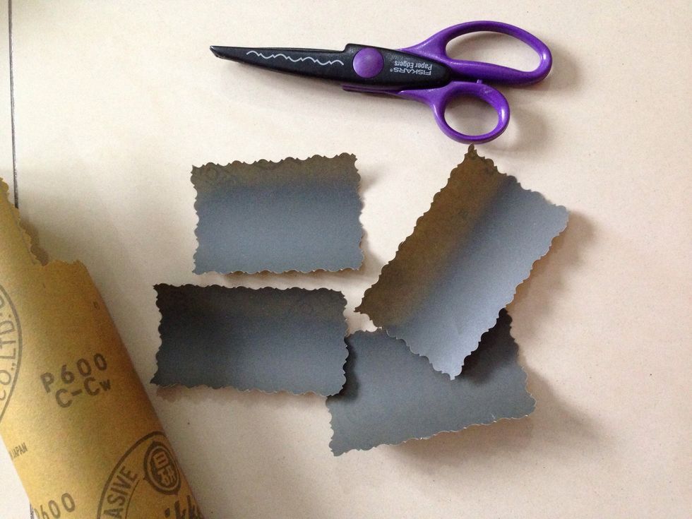 Cut the sandpaper according the line you draw before with scissors or Fiskars paper edgers.