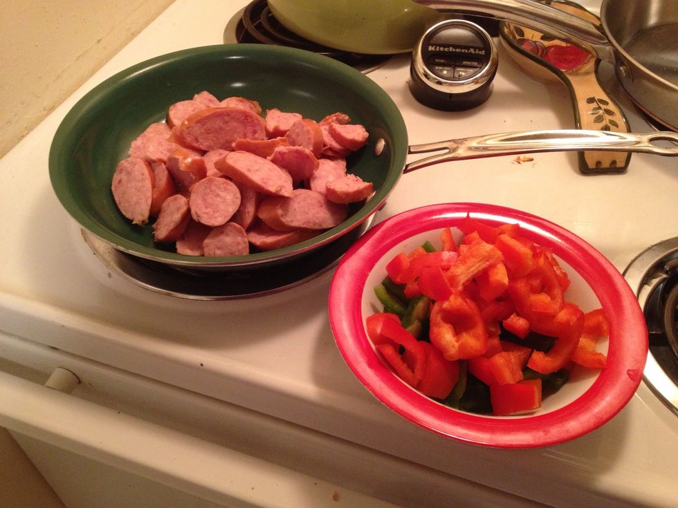 Cut the sausage in round pieces and cut up the peppers as I have done here. You can add onion too if desired. I just didn't here. Make sure the vegetables are not added til the meat is cooked.