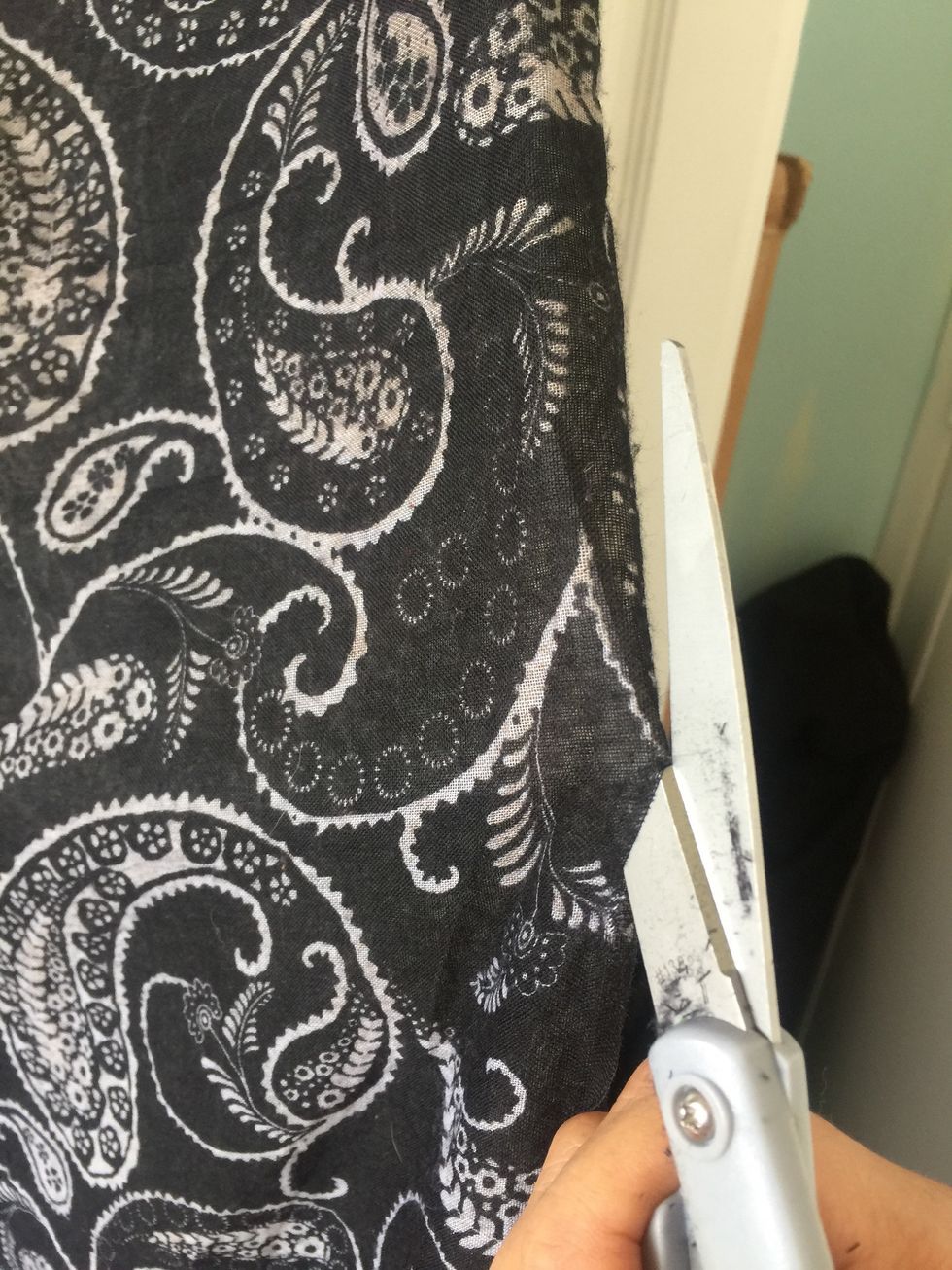 Cut the scarf along in the middle the long part