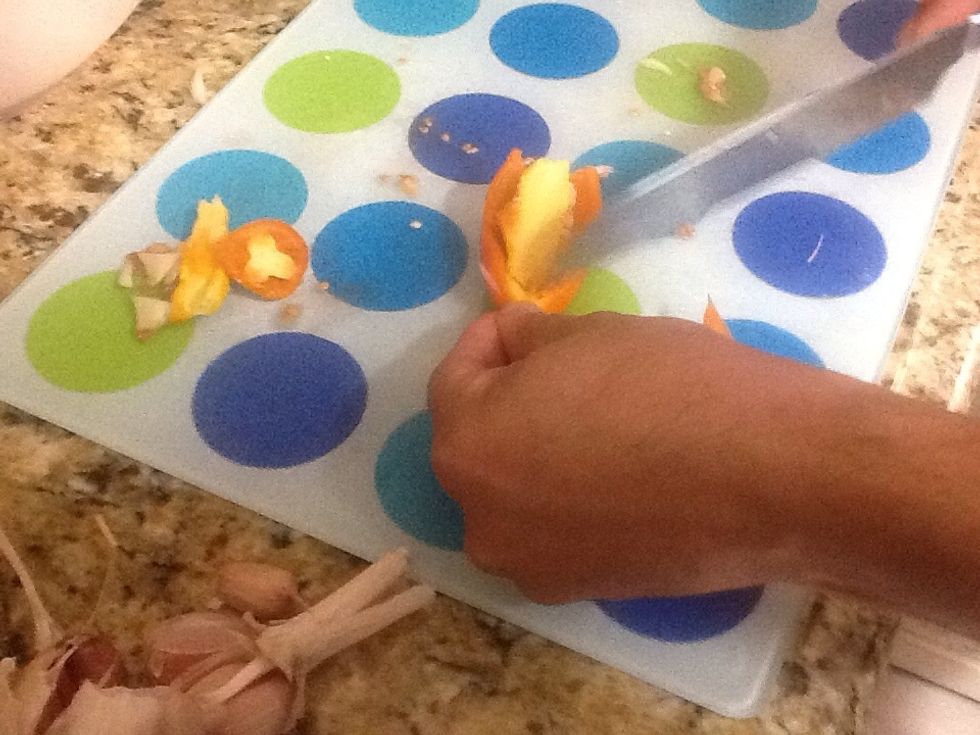 Cut the seeds and lighter color ridges from the mild pepper.