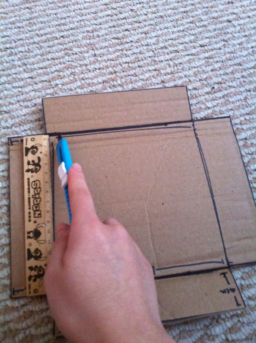 Cut the shape out, and slightly cut the 4 sides around the square, DO NOT cut through it, just cut very slightly.