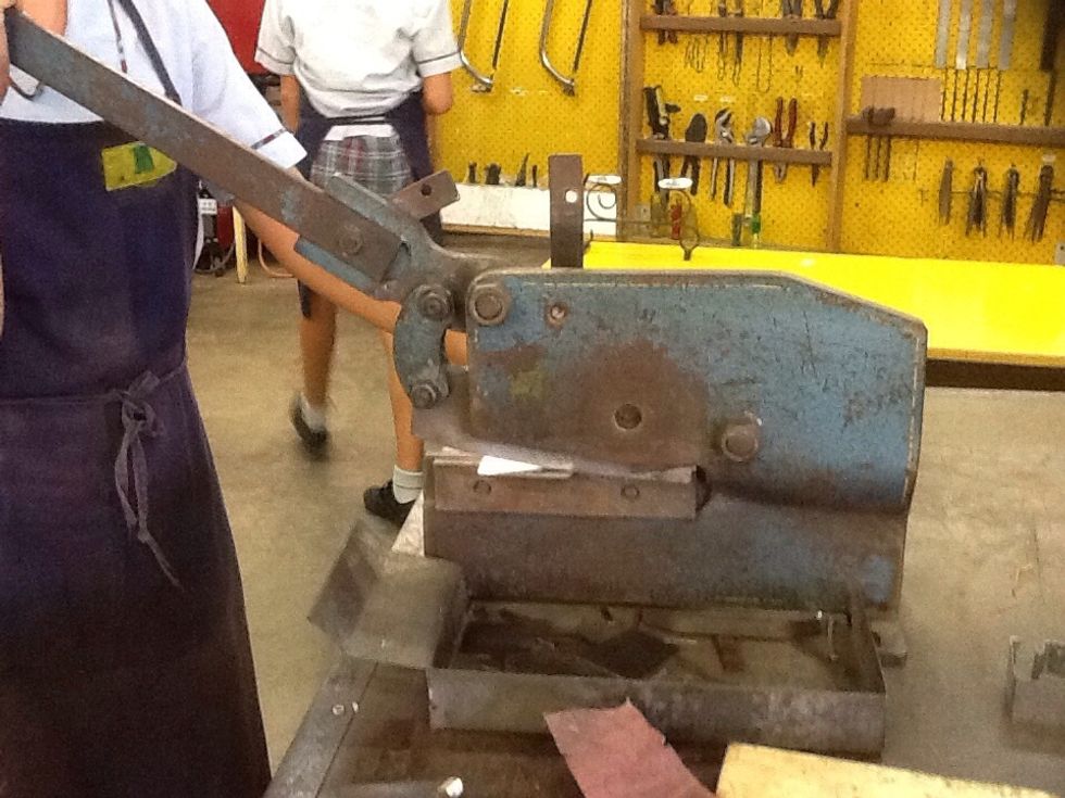 Cut the sheet metal using the guillotine