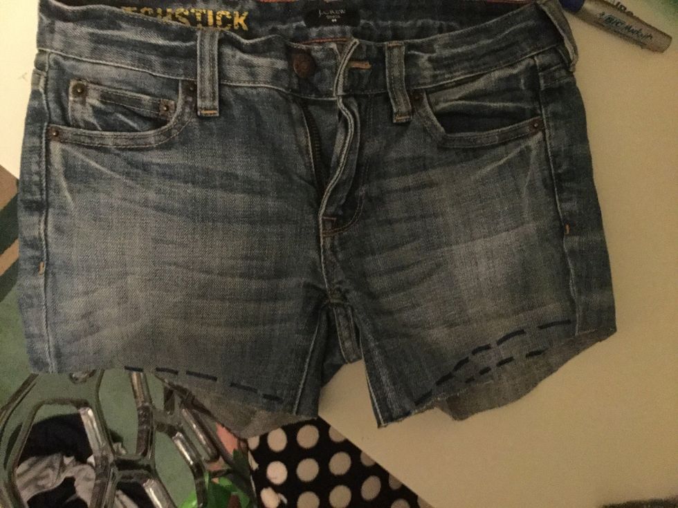 Cut the shorts a little below the dotted line