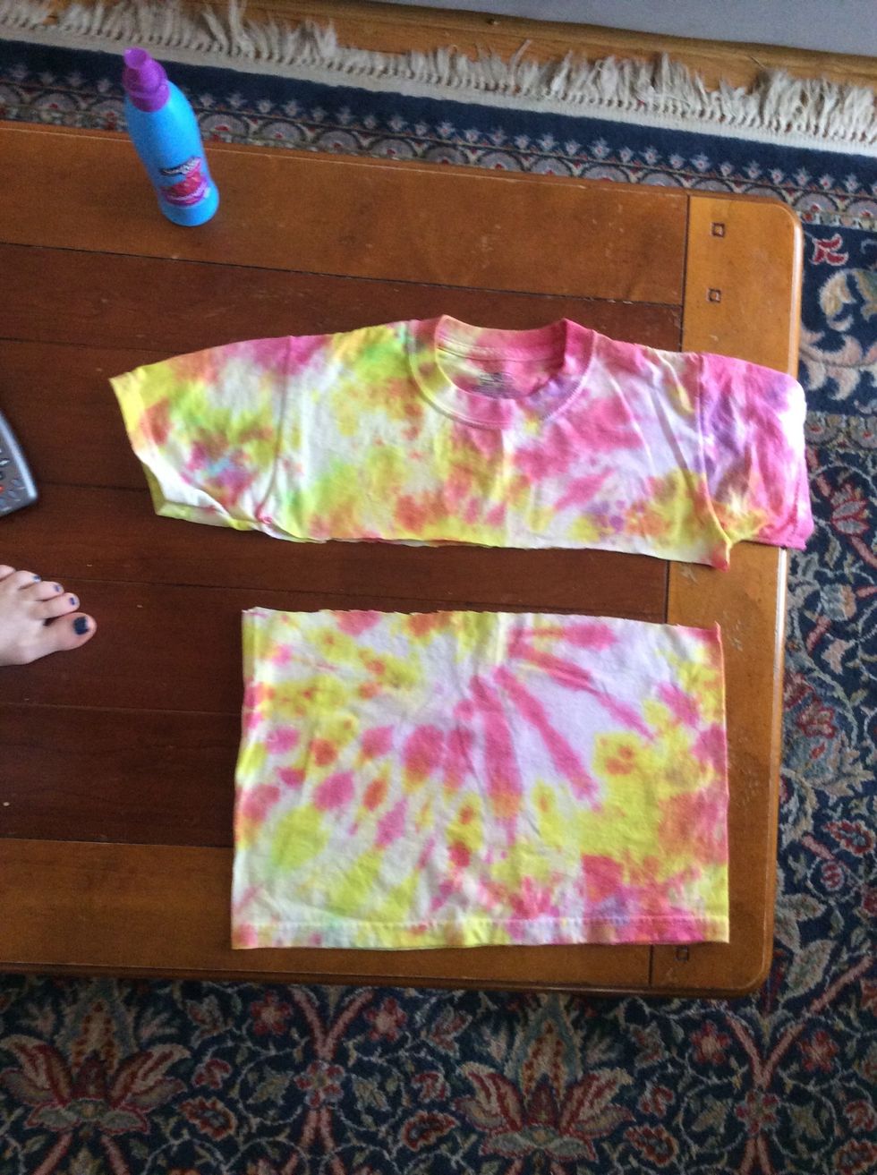 Cut the sleeves, and neckline off, so you just have a tube of fabric.