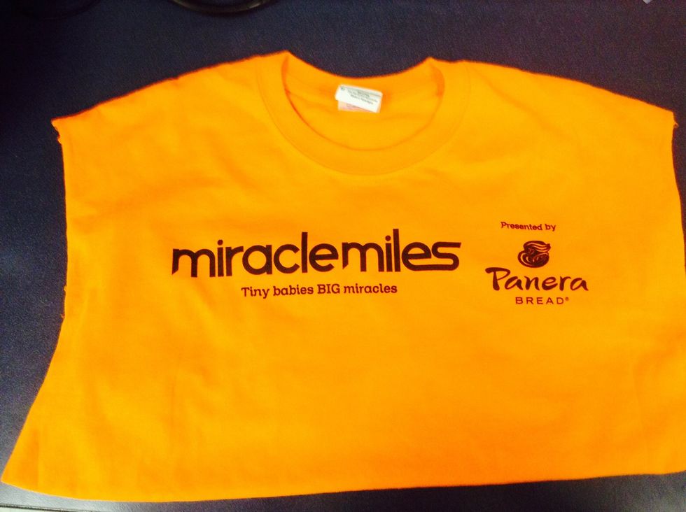 Cut the sleeves off and the rim at the bottom o the shirt.