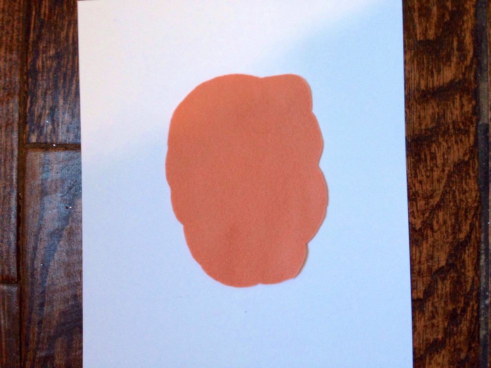 Cut the square into a circular shape and scallop the edges.